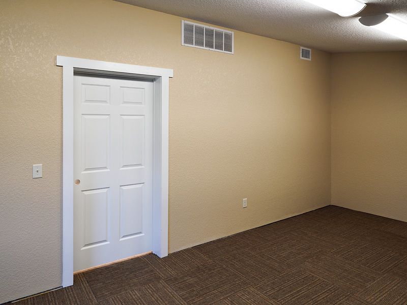 Air vents in a wall near the ceiling.